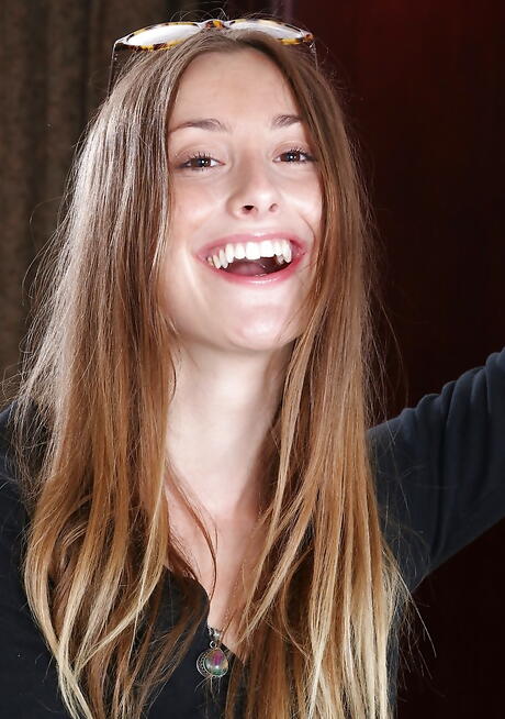 Foxy youthful Lilith Black revealing small tits and hairy pussy 