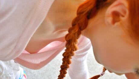 Luscious american red-haired teen Dolly Little in fancy skirt exposing small tits and playing with dildo outside